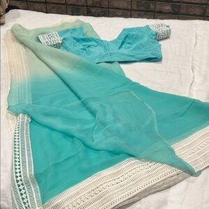 Pure chiffon saree with matching blouse. Green Ombre colors with lace border